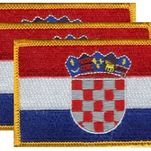 May include: Three embroidered patches featuring the Croatian flag. Each patch has a red, white, and blue design with a coat of arms. The patches have a gold border.
