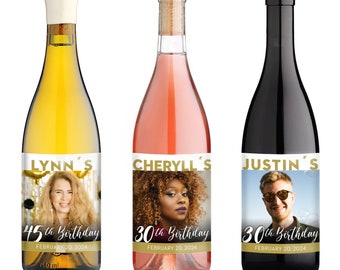 May include: Three wine bottles with personalized labels featuring photos and text. The labels are gold and white with the names Lynn's, Cheryll's, and Justin's. Each label includes the text "th Birthday" and a date. The bottles are white, rose, and red wine.