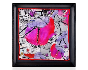 May include: Framed artwork featuring a vibrant abstract design. The artwork showcases a silk scarf with a colorful illustration of figures in purple polka-dot dresses and bright pink accents. The scarf is framed in a black wooden frame with a red border.