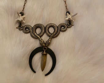 Snake and dagger necklace