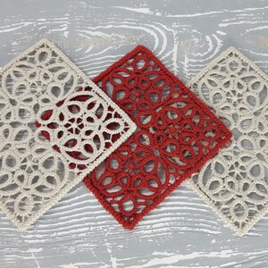 May include: Three square crocheted doilies, one red and two off-white, with intricate floral patterns.