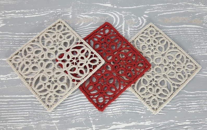 May include: Three square crocheted doilies, one red and two off-white, with intricate floral patterns.