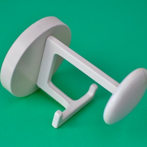 White plastic wall hook I Schonbuch (?) I home and living I storage and organisation I hooks and fixtures I Marie Kondo I vintage I patina
