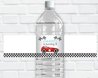 May include: Water bottle label with a red race car and checkered flag design. The label says "DANIEL is turning 3!"