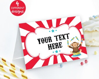 May include: Red and white striped circus themed printable place card with a white cloud shaped frame. The frame has the text "YOUR TEXT HERE" in black. A cartoon monkey juggling blue and yellow clubs is in the bottom right corner.