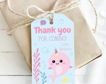 May include: A blue thank you tag with a pink narwhal with a rainbow horn, seaweed, and a yellow starfish. The tag says "Thank you for coming! Love, Melissa".