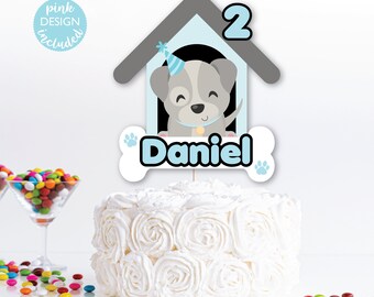 May include: A blue and gray dog house cake topper with a cute cartoon dog wearing a party hat. The topper also includes the number 2 and the name "Daniel".