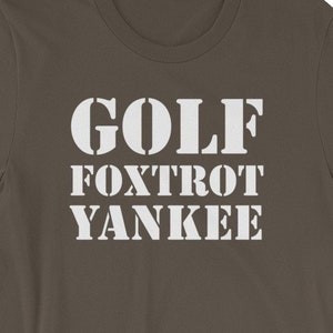 May include: A dark brown t-shirt with white text that reads "GOLF FOXTROT YANKEE".