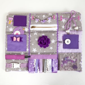 Sensory activity mat in lavender colors with different fidget items. Dimensions: 15x12 (40 x 30 cm)
weight about 0.26 lb. (about 130 gr)