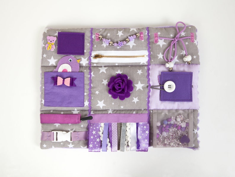 Sensory activity mat in lavender colors with different fidget items. Dimensions: 15x12 (40 x 30 cm)
weight about 0.26 lb. (about 130 gr)