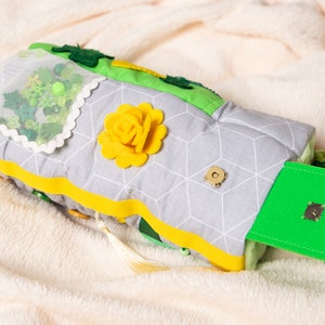 Pocket where you can put a postcard or nice little things. Decorated with felt