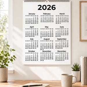 Printable 2026 calendar digital download with a simple year-at-a-glance design showing all 12 months on one easy-to-read page. This instant download includes black and white, coloured, and fantasy-style calendar versions in multiple sizes, ideal for printing at home and using for yearly planning, office organisation, school schedules, goals, holidays, deadlines, and important dates.