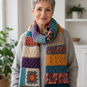 Long handmade crochet scarf with teal, mustard, purple, cream, rust, and multicolor patchwork sections for cozy winter styling.