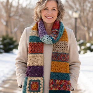 Crochet granny square motif tutorial showing a flower-style center, cream border, teal edging, and hook placement in the corner space.
Crochet scarf assembly tutorial showing colorful panels being joined with a yarn needle and flat seam technique.
Finishing tutorial for crochet scarf showing edging, weaving in yarn ends, blocking, and optional decorative variations.
Printable crochet scarf pattern PDF with colourful patchwork panels, cosy handmade texture, and beginner-friendly  instructions.