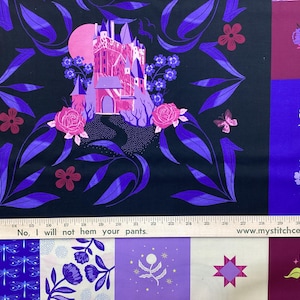 May include: Fabric with a fantasy design featuring a pink castle, flowers, and a butterfly on a black background. The fabric also has a variety of other designs, including hearts, dragonflies, and stars. The text "Glow Garden" and "SARAH WATTS" is visible.