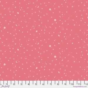 May include: A coral pink fabric featuring a repeating pattern of small white stars, crescent moons, and circular planets. A white ruler with black markings is visible at the bottom, showing a measurement scale from 0 to 12 inches.