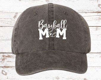 May include: A dark gray baseball cap with the text "Baseball Mom" in white with a white baseball and heart graphic.