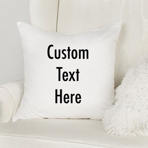 May include: White throw pillow with black text that reads "Custom Text Here".