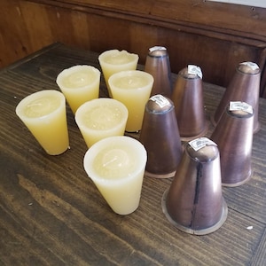 12 UNSCENTED sugar mold candles and 12 tin cups