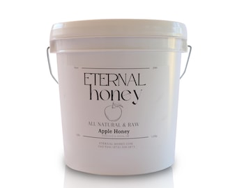 May include: A white plastic bucket with a black label that reads "ETERNAL honey" and "ALL NATURAL & RAW Apple Honey". The label also includes the company's website and phone number.