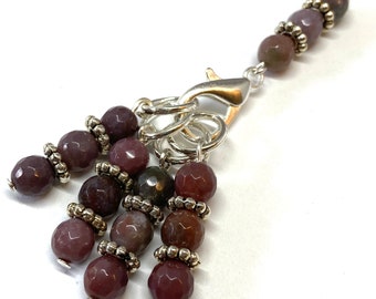 Mauve agate stitch markers for knitting, set of five, four knitting markers and one stitch holder, with faceted mauve agate beads.