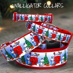 May include: Three pet collars with a white background featuring a repeating Snoopy and Christmas tree pattern. The collars have red plastic buckles and red webbing. The text WALLIGATOR COLLARS is visible at the top of the image.