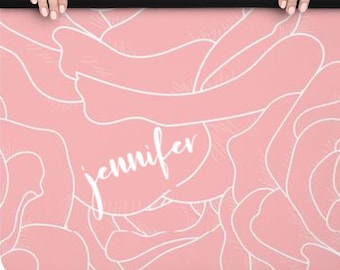 May include: A pink yoga mat with a white floral pattern and the name "Jennifer" written in white cursive.