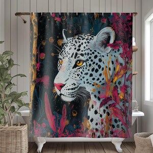 May include: A shower curtain featuring a close-up of a white leopard with black spots against a dark background with splashes of pink, red, and gold paint.