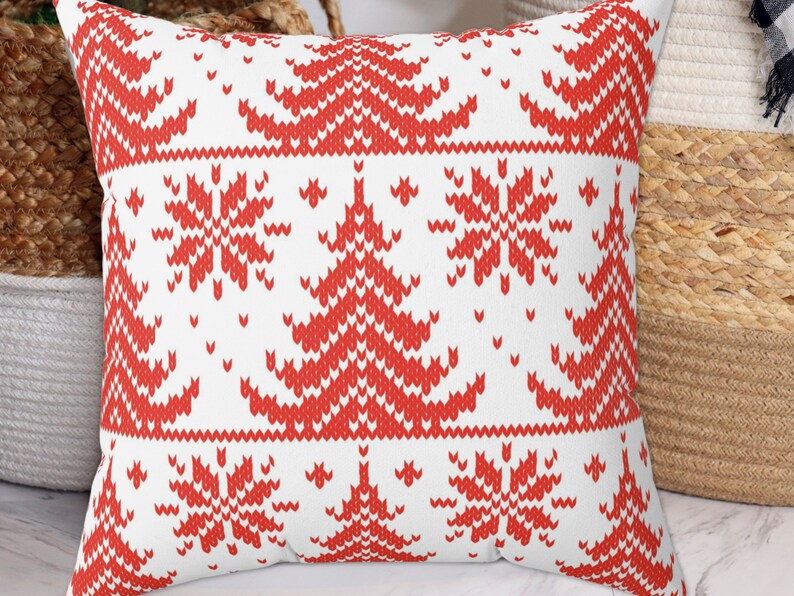 May include: Red and white cushion with a knitted pattern of snowflakes and Christmas trees.