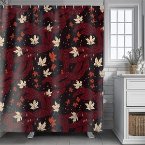 May include: A shower curtain with a repeating pattern of burgundy-colored, intertwined leaf shapes and scattered maple leaves in cream and orange hues against a black background. The curtain is hanging in a bathroom.