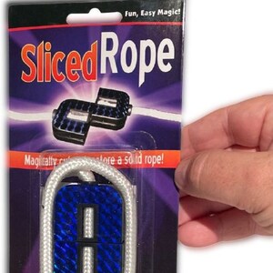 May include: A white rope with blue and silver ends. The ends are connected by a white rope. The package says "Sliced Rope" and "Fun, Easy Magic!"  Magically cut and restore a solid rope!  Trickmaster.