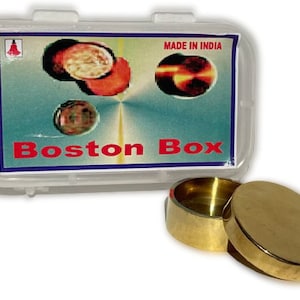 May include: A brass Boston Box with a lid, in a clear plastic case. The case has a label that says "Boston Box" and "Made in India".