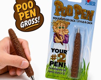 May include: A brown, textured ballpoint pen shaped like a piece of excrement. The packaging features the text "Poo Pen Gross!", "Your #2 Pen!", and an illustration of a person holding the pen. The pen has a silver metal tip and writes in black ink.