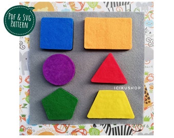May include: A felt board with six different shapes: a blue square, an orange rectangle, a purple circle, a red triangle, a green pentagon, and a yellow trapezoid. The shapes are on a gray background with a white border.