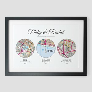 May include: A framed print with three circular maps representing significant locations in a couple's relationship. The maps are labeled "Met", "Engaged", and "Married" with the corresponding locations and years. The text "Philip & Rachel" is at the top of the print.
