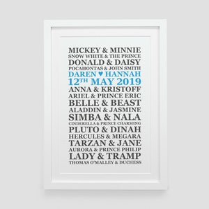 May include: A white framed print with a blue and black text design. The text lists Disney couples with their names, including Mickey & Minnie, Snow White & The Prince, Donald & Daisy, and more. The date "12th May 2019" is also included in the design.