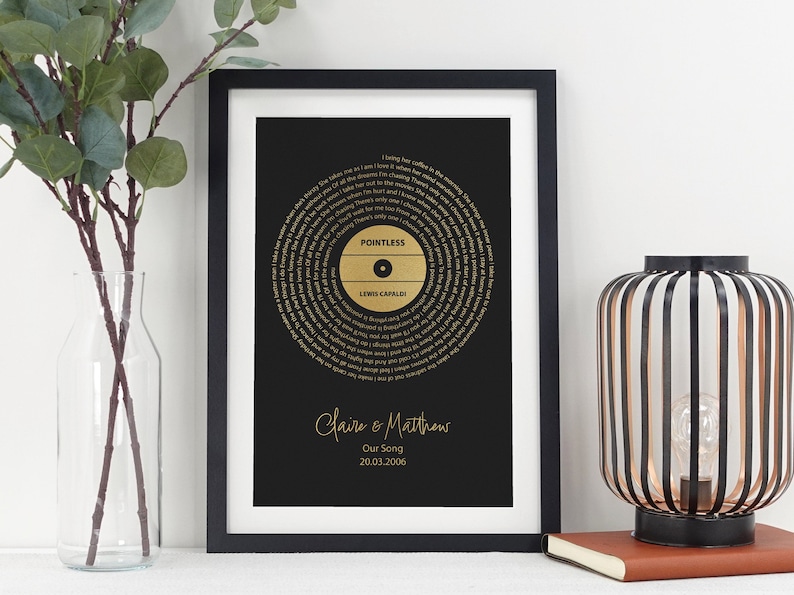 May include: A black framed print with a gold record design featuring the song "Pointless" by Lewis Capaldi. The print includes the names "Claire & Matthews" and the date "20.03.2006".