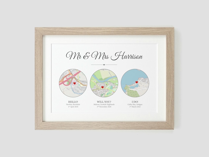 May include: A framed print with a white background and three maps. The maps are labeled "Hello", "Will You?" and "I Do!" with dates and locations. The text "Mr. & Mrs. Harrison" is at the top of the print.