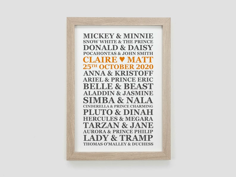 May include: A framed print with a white background and black text listing Disney couples with their names. The text "Claire &hearts; Matt 25th October 2020" is in orange.