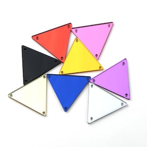 May include: Assortment of eight triangular mirror tiles in various colors, including red, pink, yellow, black, blue, purple, silver, and gold.