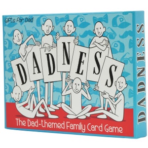 May include: A blue box with the words "DADNESS" and "The Dad-themed Family Card Game" on it. The box features a cartoon illustration of stick figures holding letters that spell out the word "DADNESS".