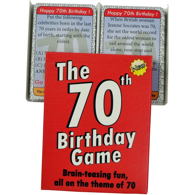 May include: A red box with the text "The 70th Birthday Game" in white. The box has a smaller yellow star with the word "New" inside. The text "Brain-teasing fun, all on the theme of 70" is printed in black at the bottom of the box.