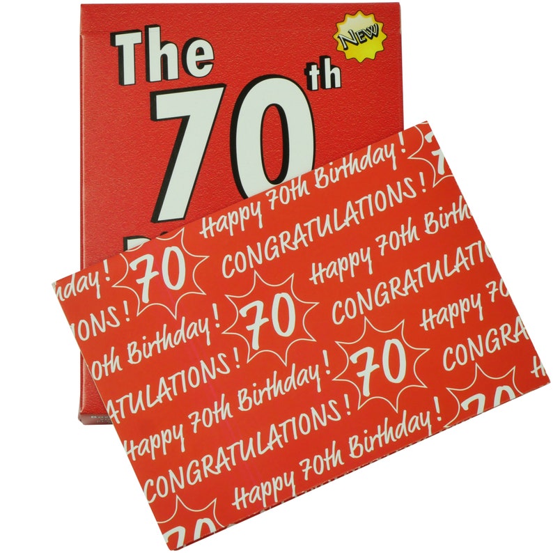 May include: A red card with the text "The 70th" in white. The card is decorated with a yellow star with the word "New" inside. The card is folded in half and a red card with a pattern of white "70"s and the text "Happy 70th Birthday!" and "Congratulations!" is visible underneath.