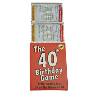May include: A red box with the text "The 40th Birthday Game" and the tagline "Brain-teasing fun, all on the theme of 40". The box contains cards with trivia questions about the number 40.