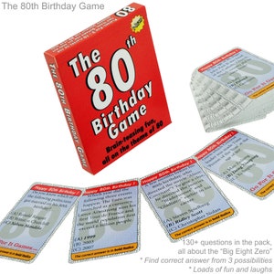May include: A red box with the text "The 80th Birthday Game" and a large white number "80" on the front. The box contains 130+ trivia cards with questions about events that happened in the year 1999, 2003, and 2007. The cards are blue with white text and have the text "Happy 80th Birthday!" at the top.