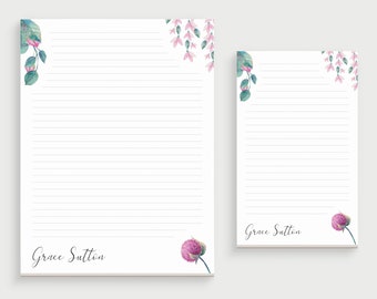 May include: Two white stationery sheets with horizontal lines, featuring watercolor floral accents in pink and green at the corners. The name Grace Sutton is printed in a black script font at the bottom of each sheet.
