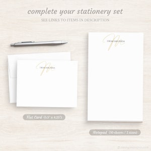 May include: A set of personalized stationery featuring a handwritten script monogram with the name "Melinda". The set includes a flat card measuring 5.5 inches by 4.25 inches and a notepad with 50 sheets in two sizes.