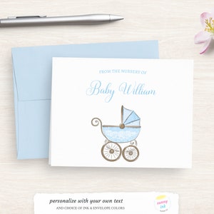 May include: A white card with blue and brown accents. The card says "From the nursery of Baby William" and features a blue baby carriage with lace details.