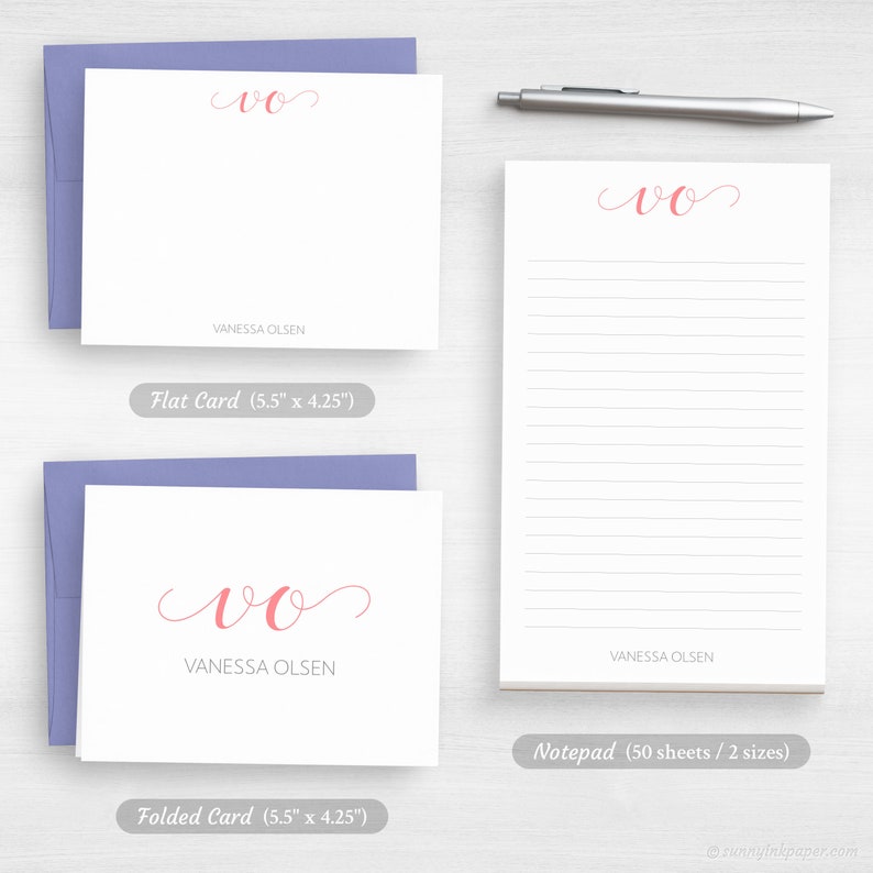 May include: A set of stationery products featuring the initials "VO" in pink cursive script. The set includes a flat card, a folded card, and a notepad with 50 sheets. All items have the name "Vanessa Olsen" printed below the initials.