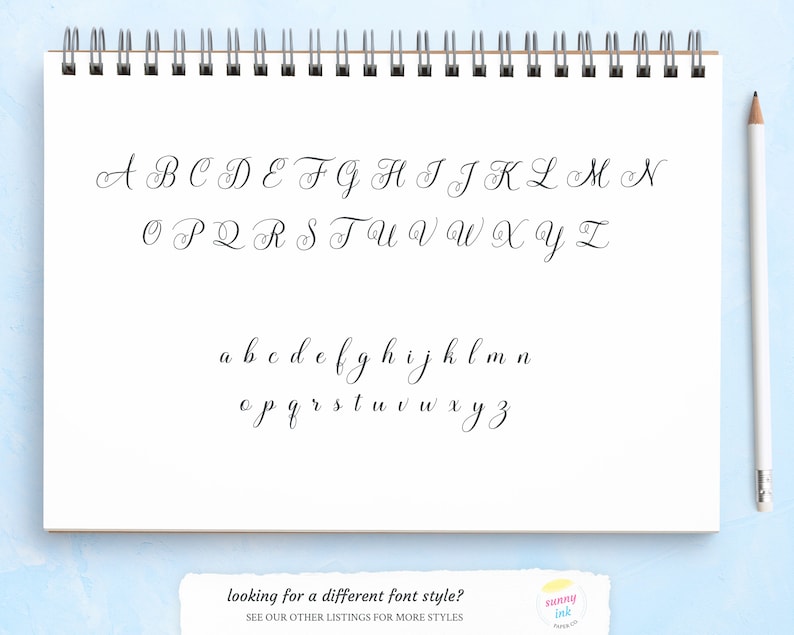May include: A handwritten alphabet in cursive script, featuring both uppercase and lowercase letters. The letters are written in black ink on a white sheet of paper.
